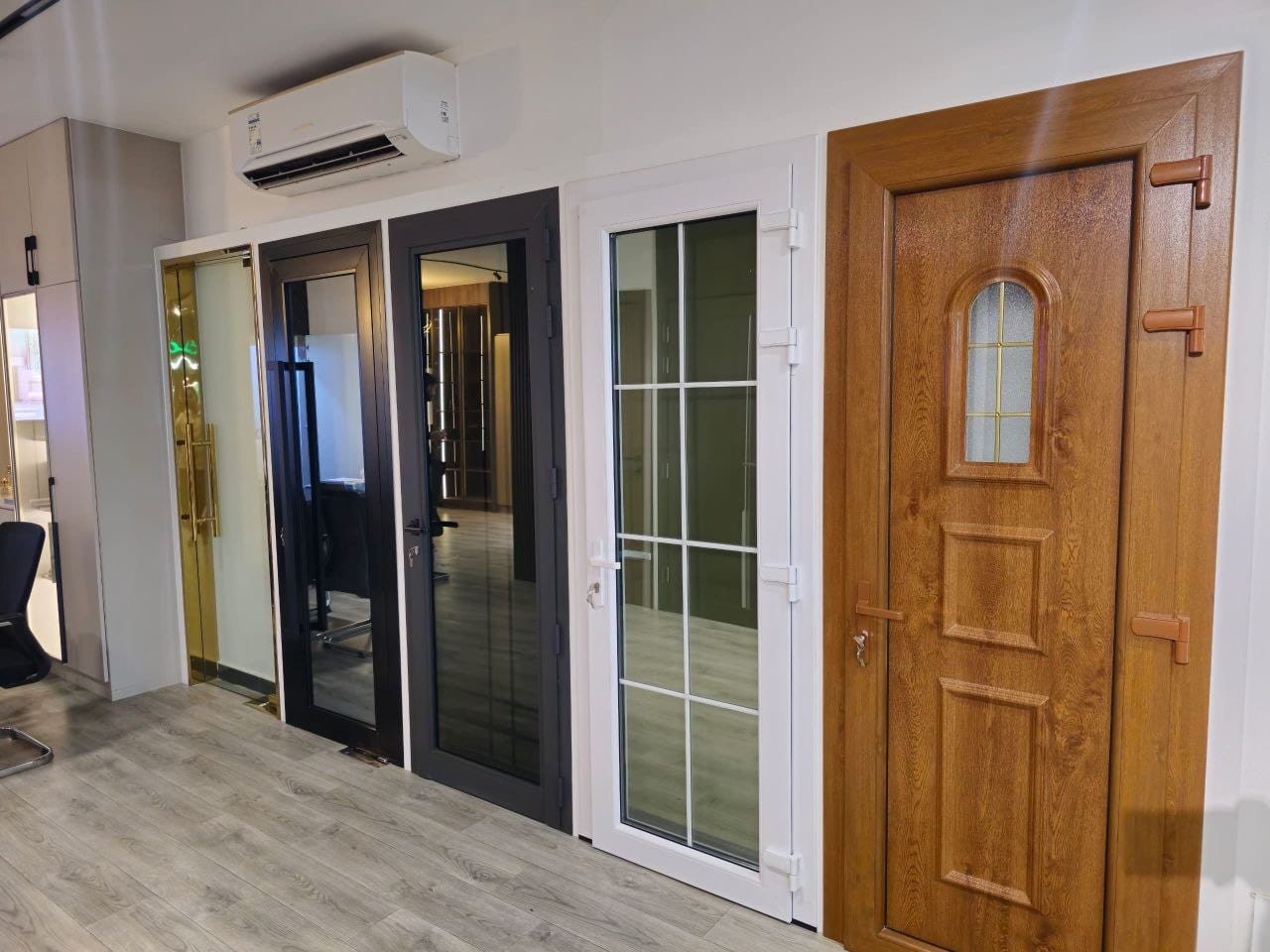 A range of aluminum doors in various colors and styles at the showroom